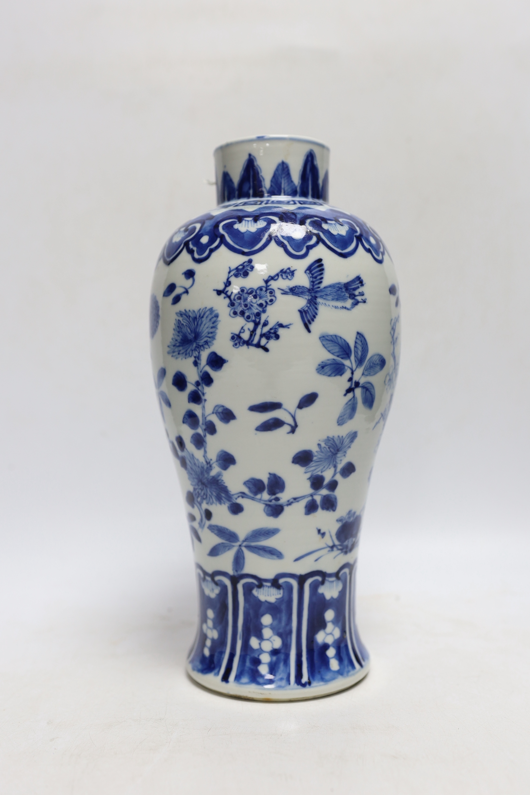 A Chinese blue and white baluster 'blackbirds amid blossom' vase, Kangxi mark, but late 19th century, 27cm
